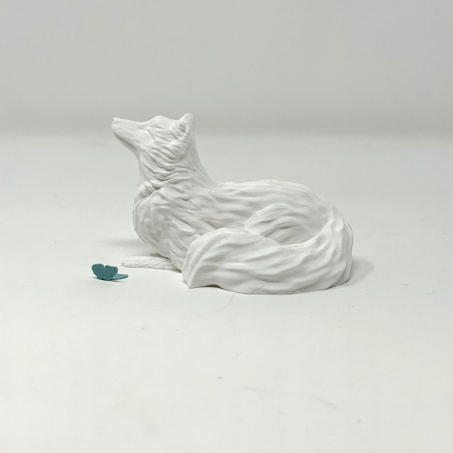 Arctic Fox with Butterfly